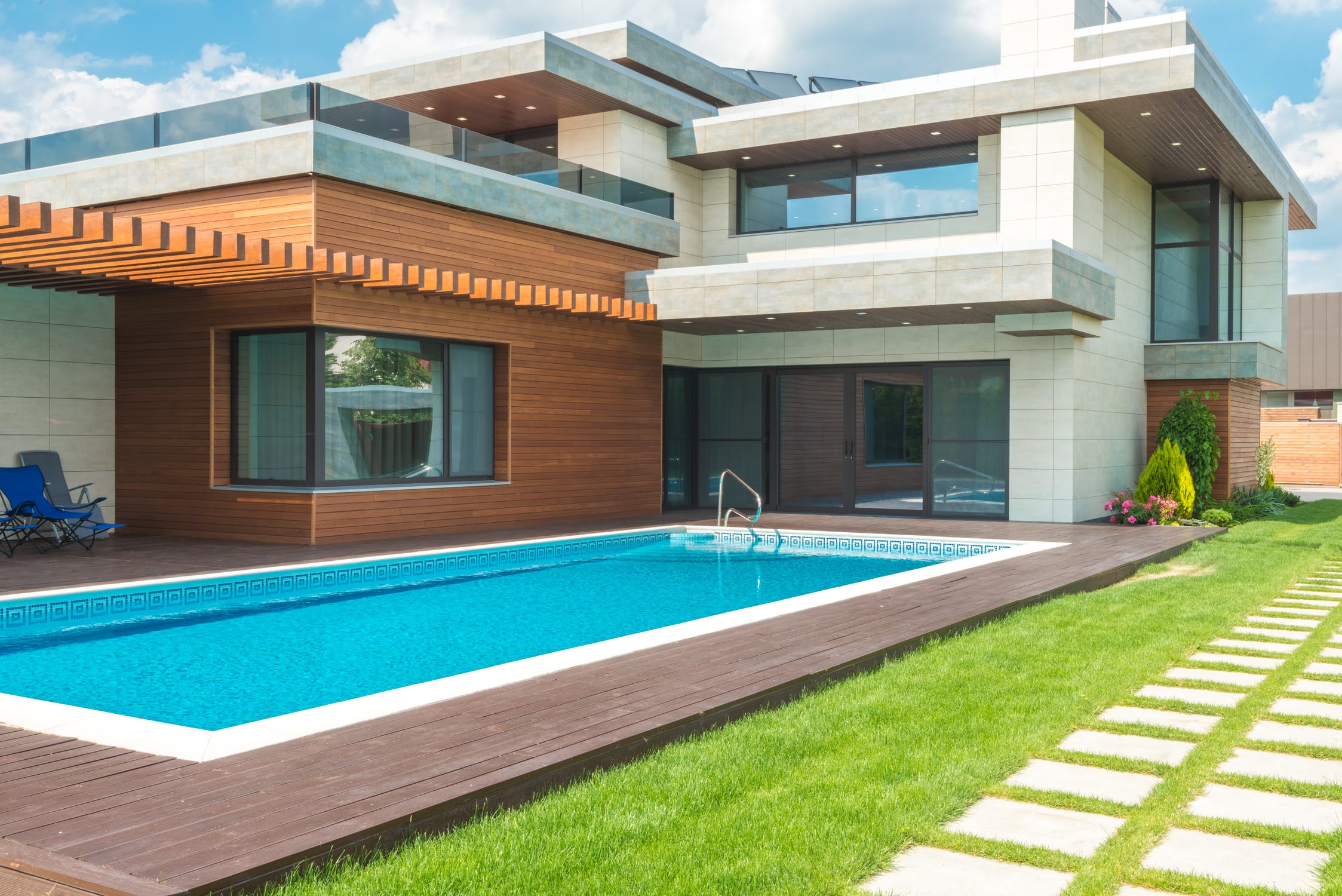 View of a modern home’s outdoor swimming pool 