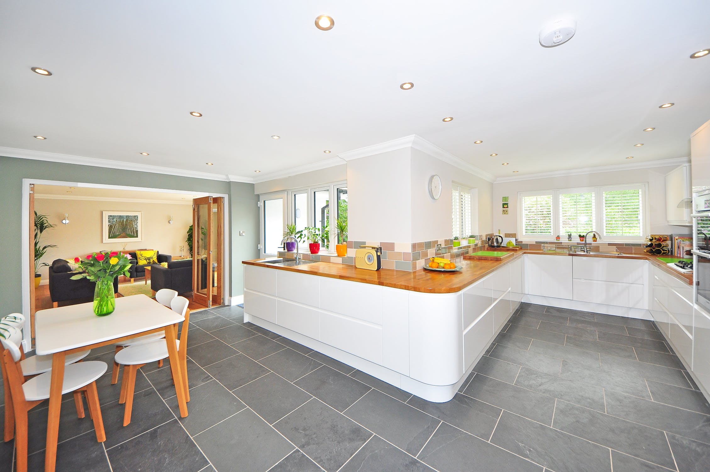 View of a modern Kitchen, Dining Room, & Living Room worthy of Country Living magazine
