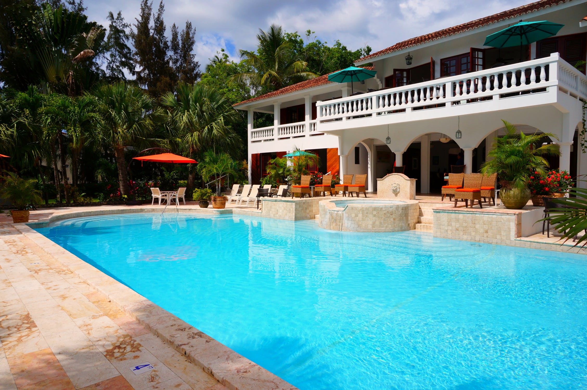 Picture of an upscale backyard swimming pool with an overlooking terrace 